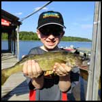image of youngster holding fish